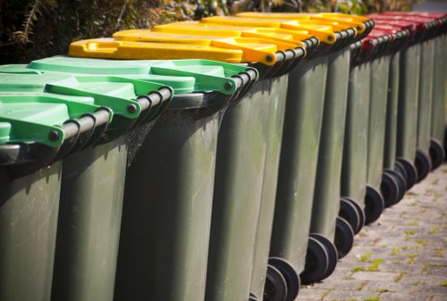 Sustainable rubbish area with segregated bins and signage