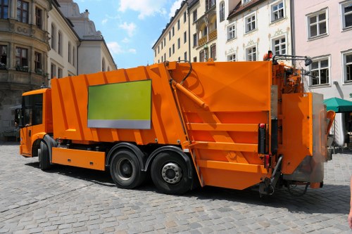 Workers performing safe waste handling during rubbish collection